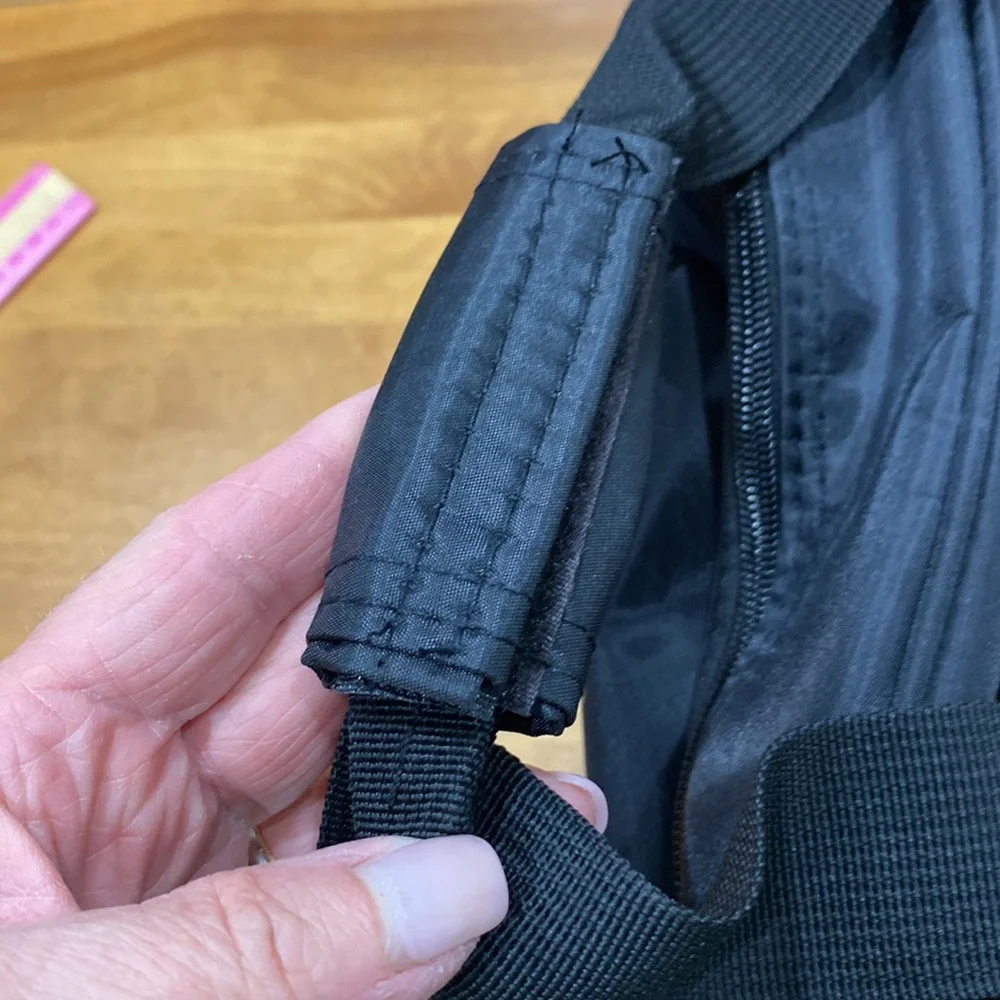 NWOT. Nylon rolling carry-on bag.